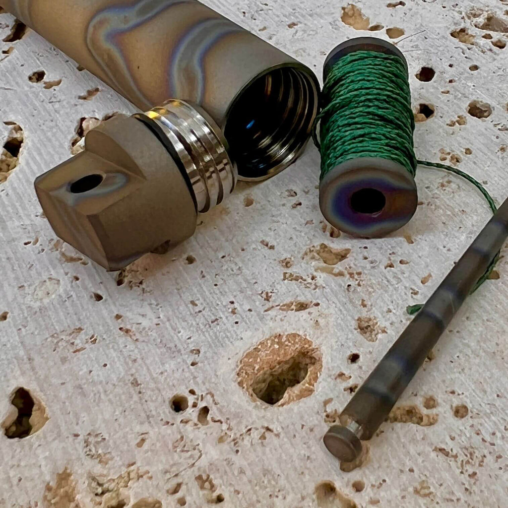 Exo Vial titanium waterproof storage capsule with matching spool