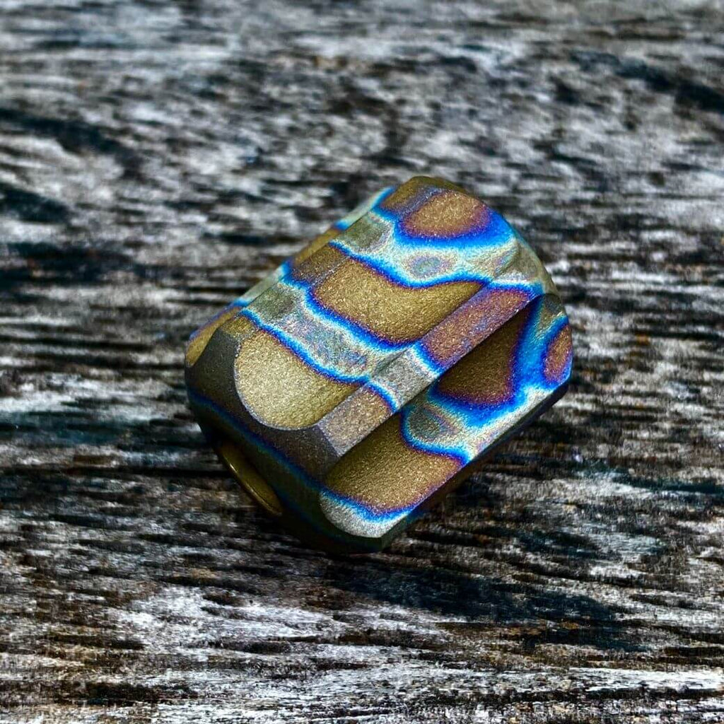 titanium slip bead with sandblasted random anodizing