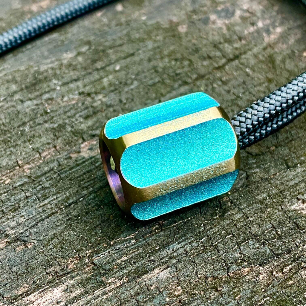 titanium slip bead with green copper anodizing