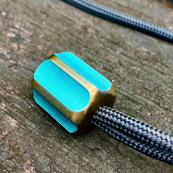 titanium slip bead with green copper anodizing
