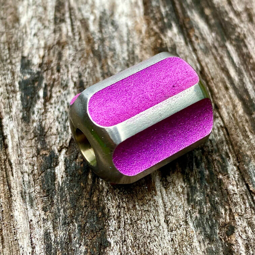 titanium slip bead with magenta silver anodizing