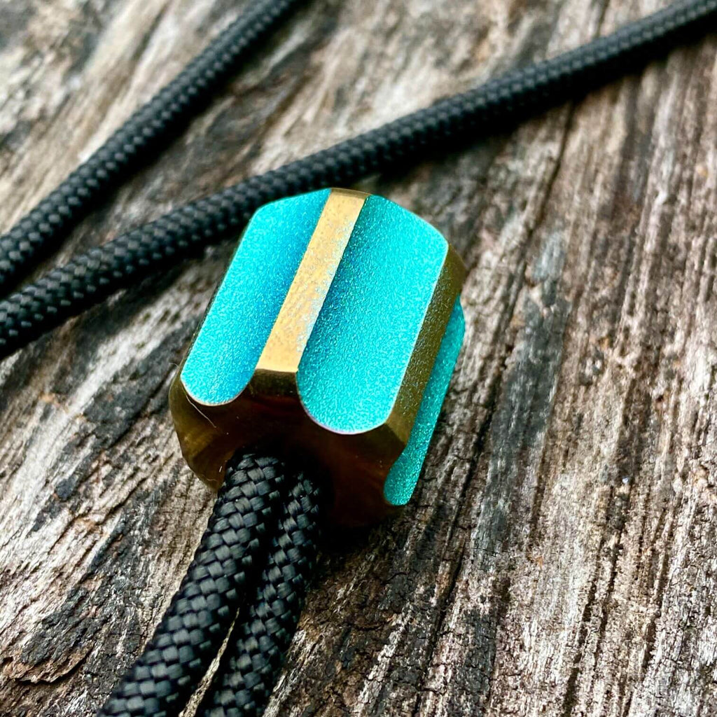 titanium slip bead with green copper anodizing