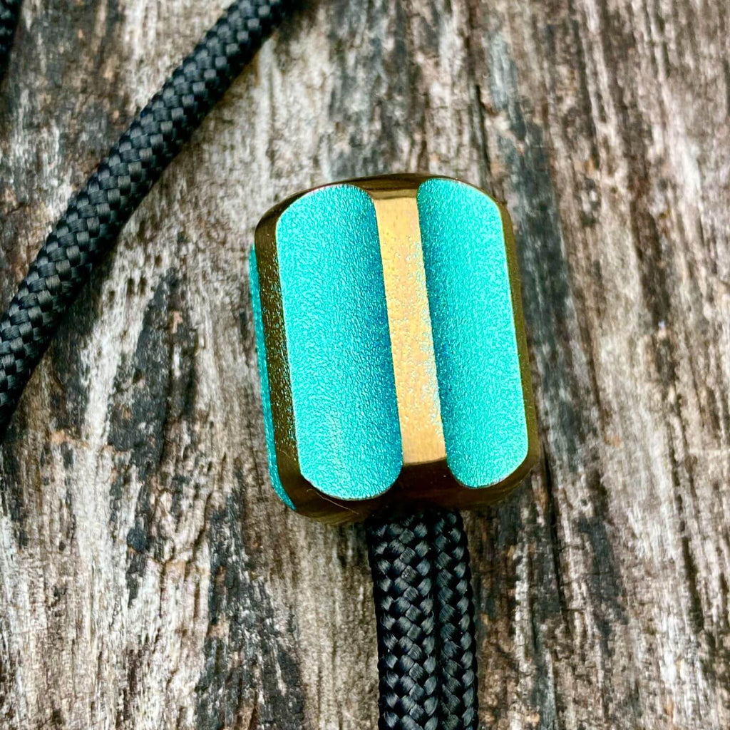 titanium slip bead with green copper anodizing