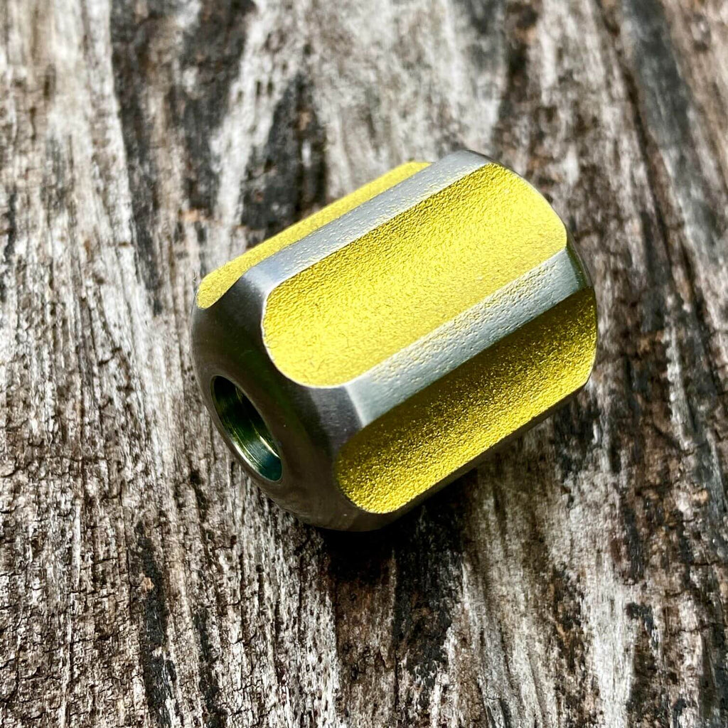 titanium slip bead with yellow silver anodizing