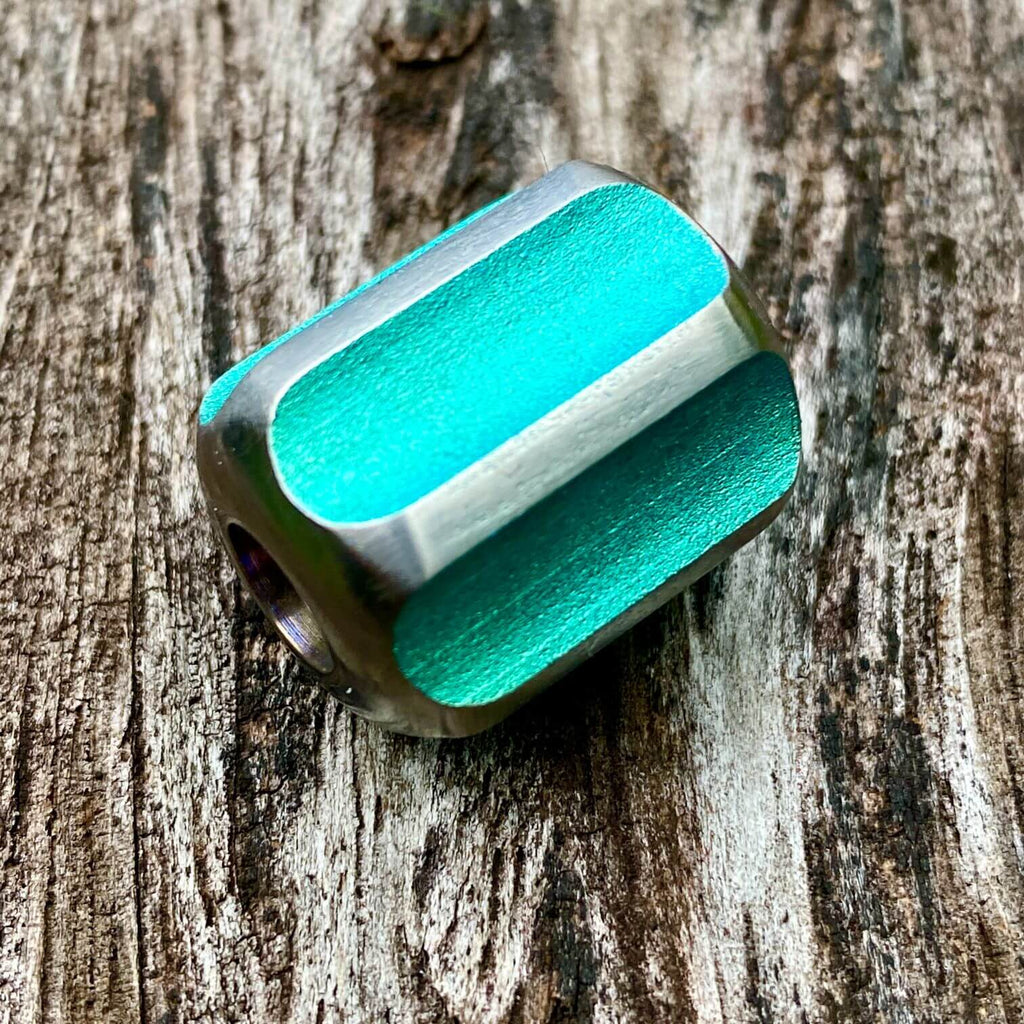 titanium slip bead with green silver anodizing