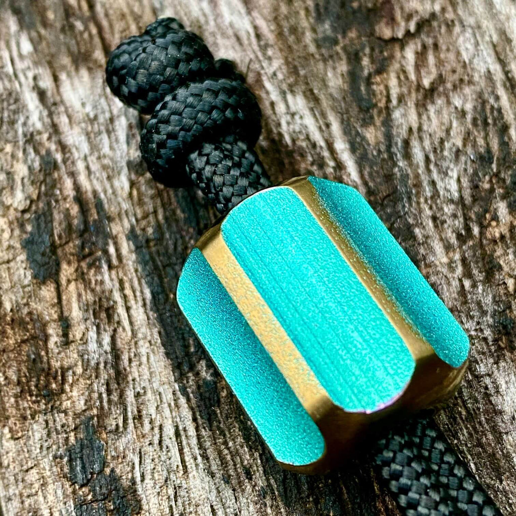 titanium slip bead with green copper anodizing