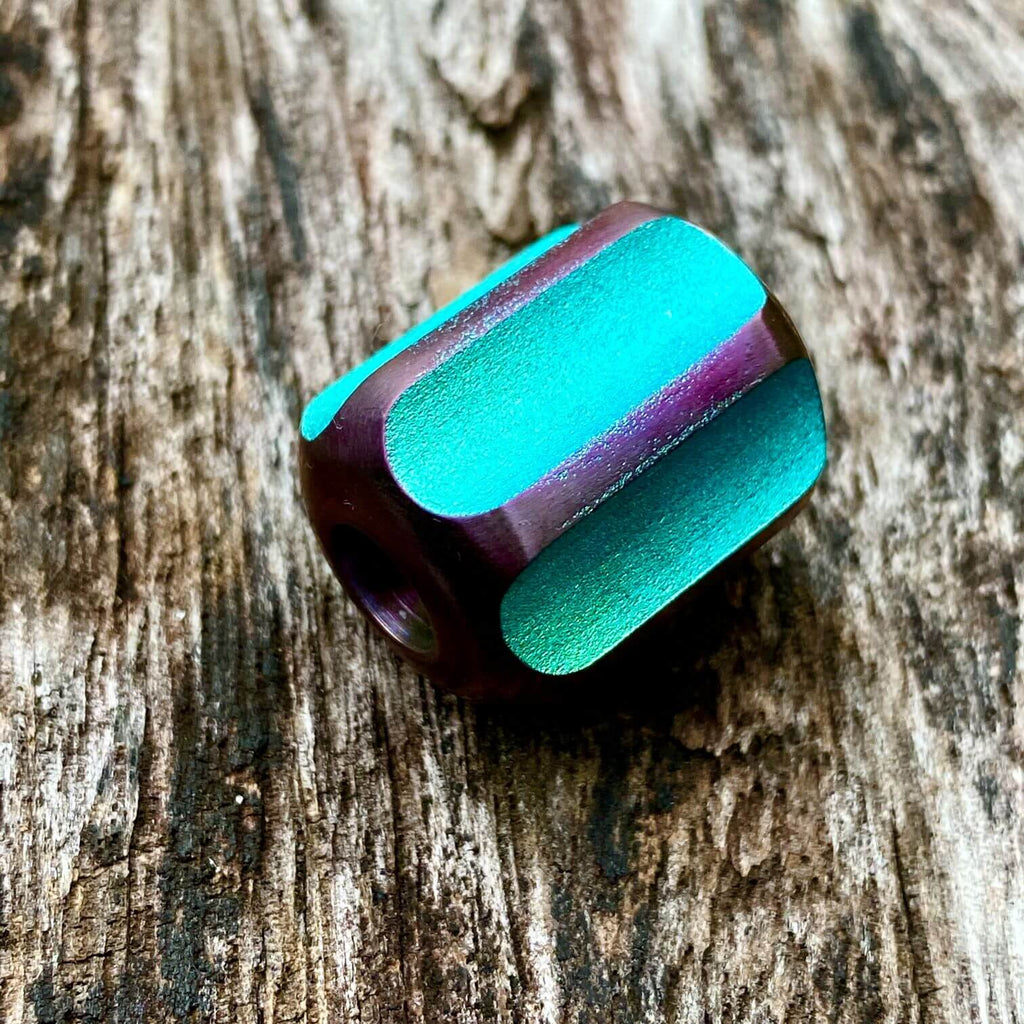 titanium slip bead with green purple anodizing