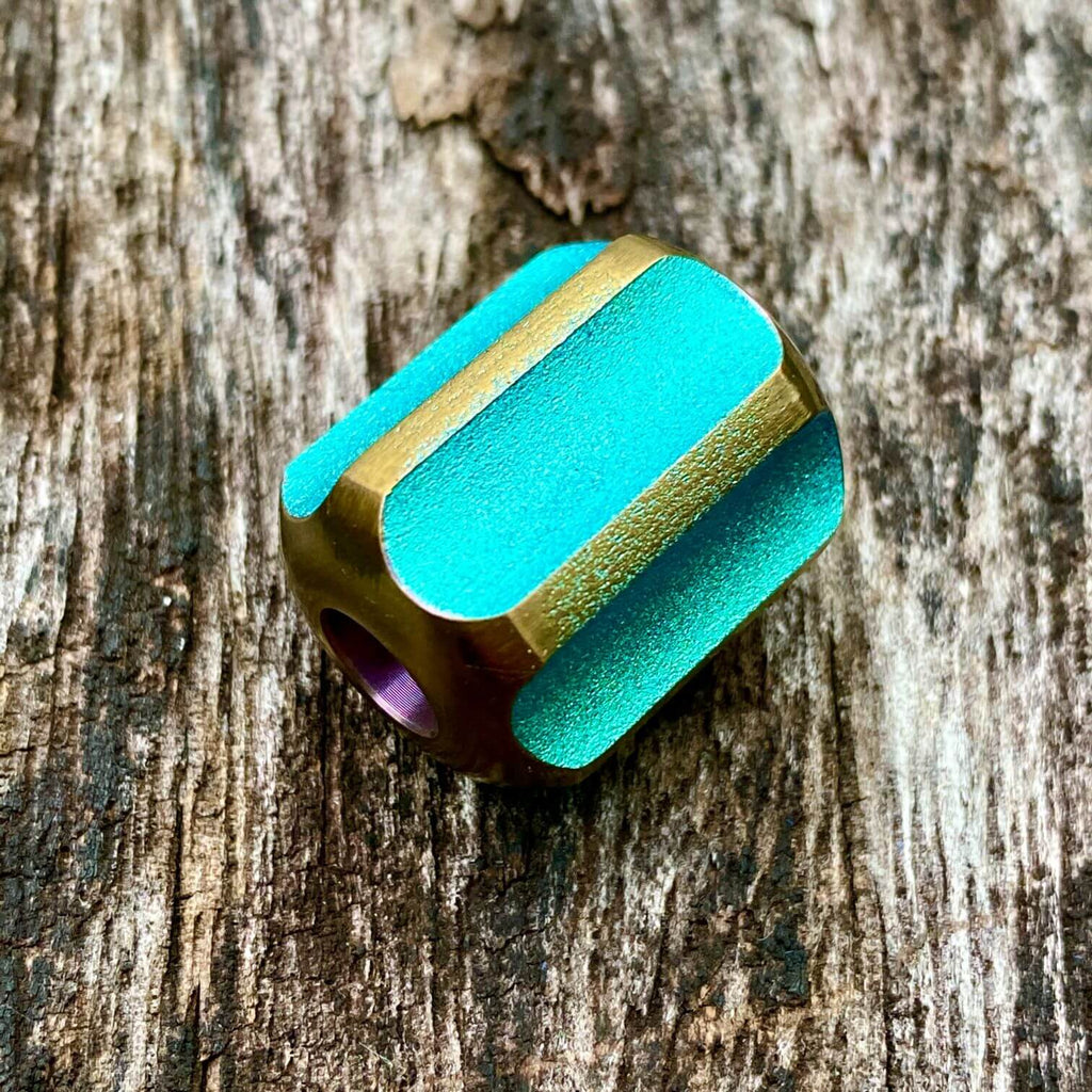 titanium slip bead with green copper anodizing