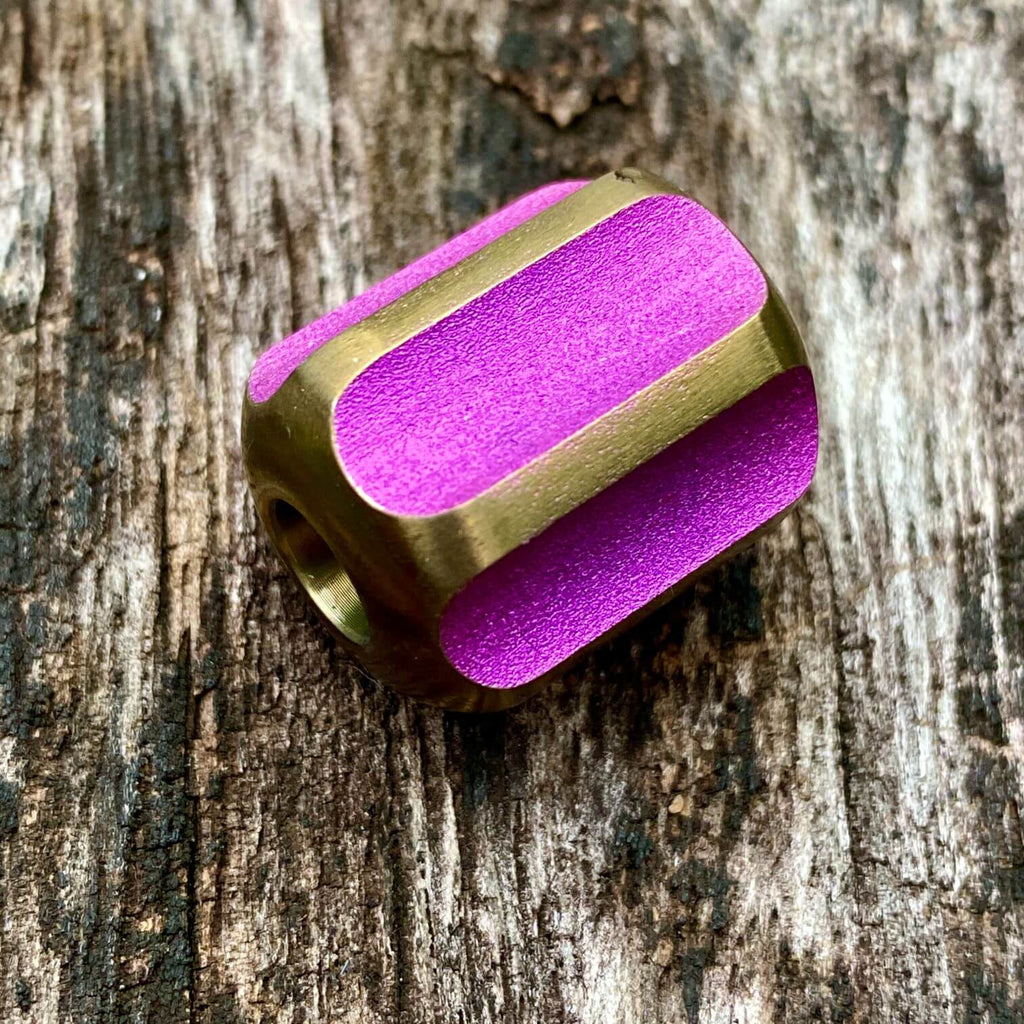 titanium slip bead with magenta copper anodizing