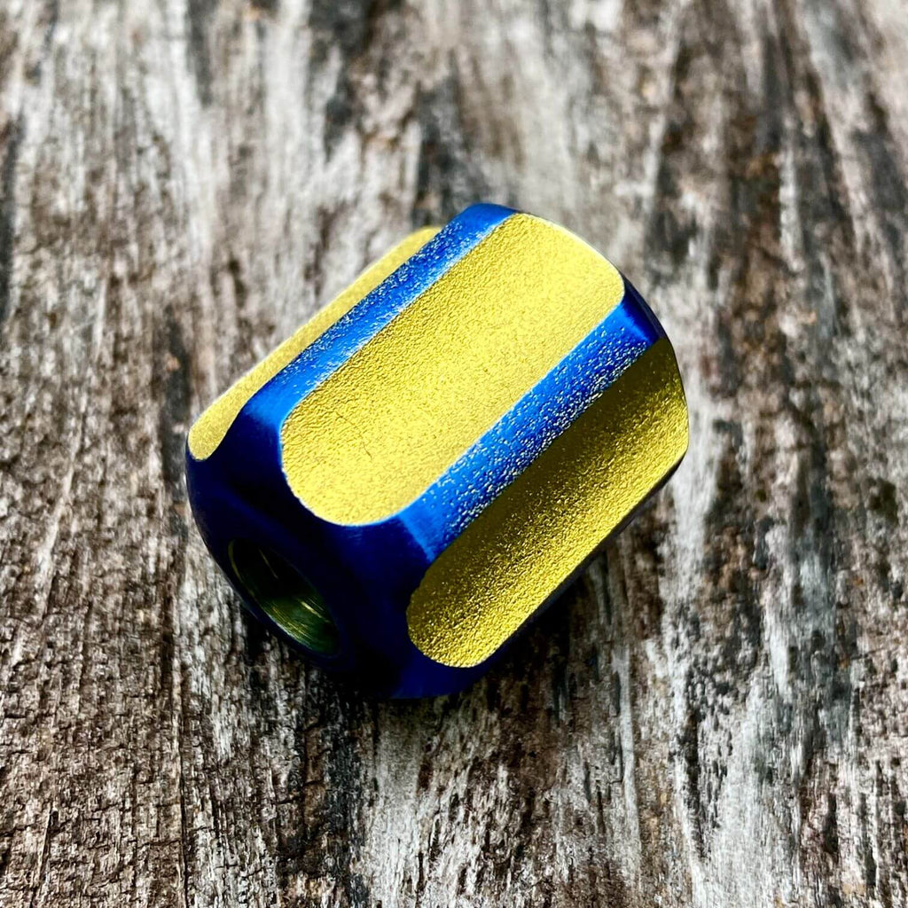 titanium slip bead with yellow blue anodizing