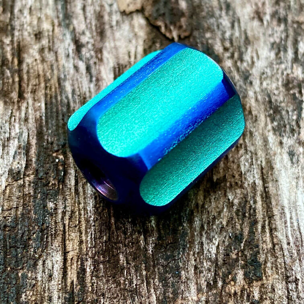 titanium slip bead with green blue anodizing