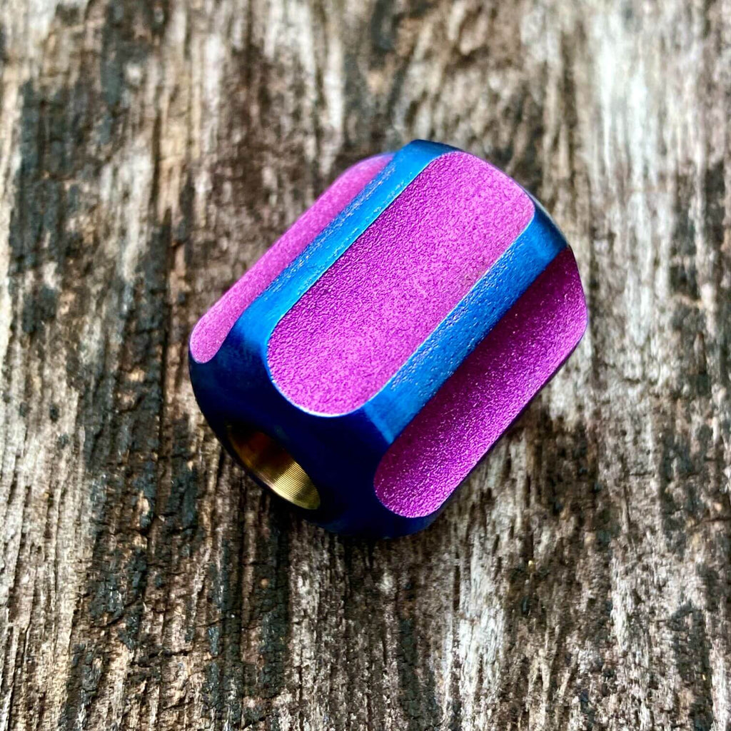 titanium slip bead with magenta blue anodizing