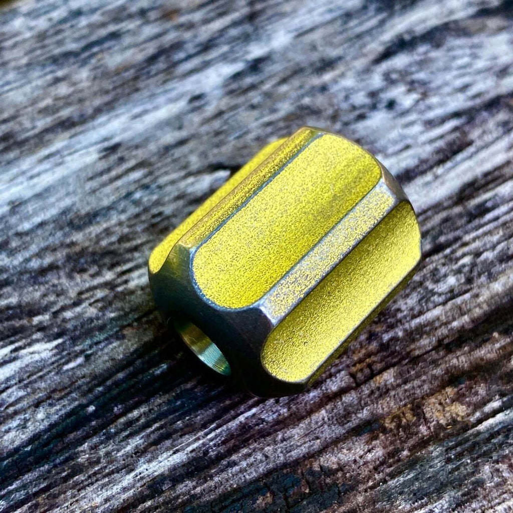 titanium slip bead with stonewashed yellow anodizing