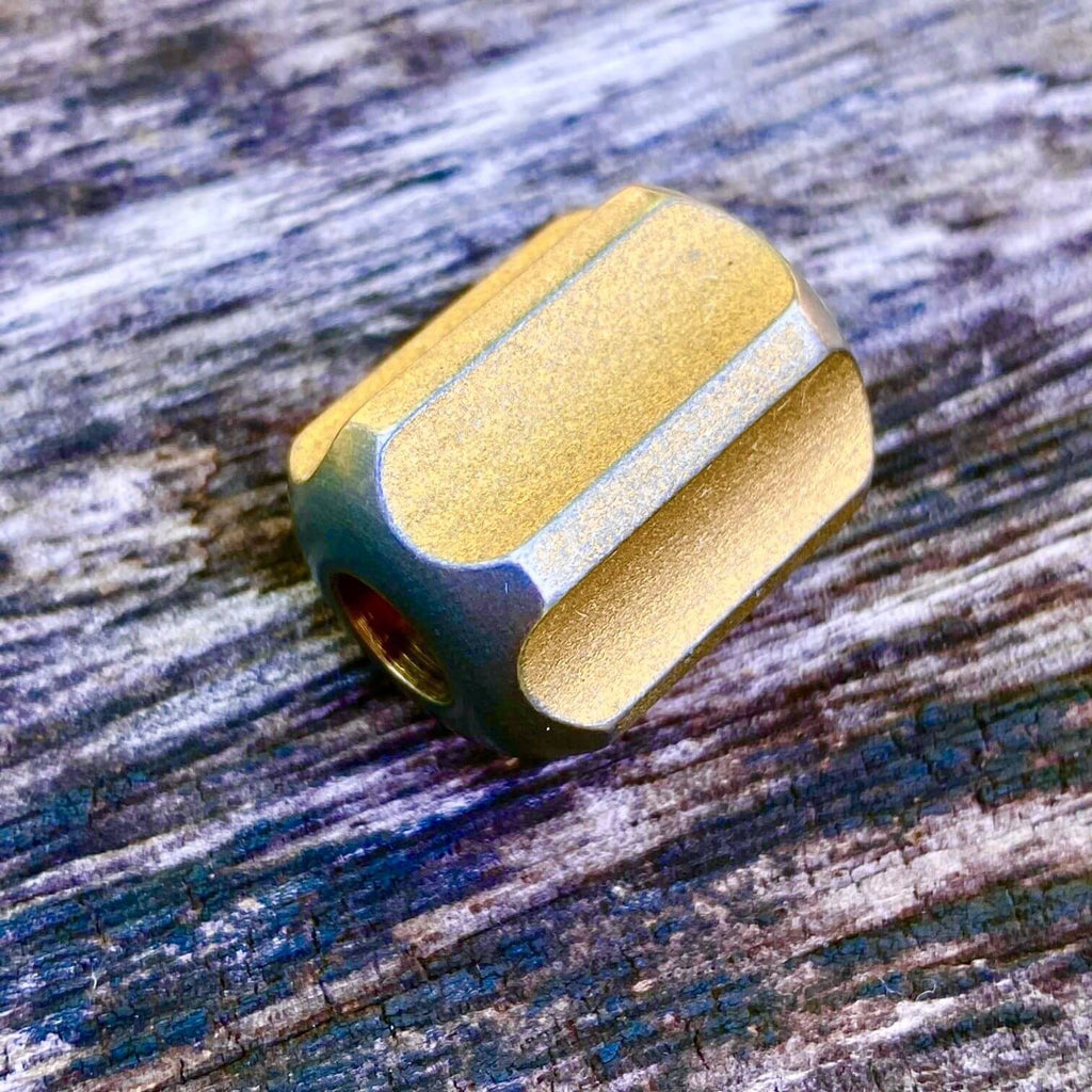 titanium slip bead with stonewashed copper anodizing
